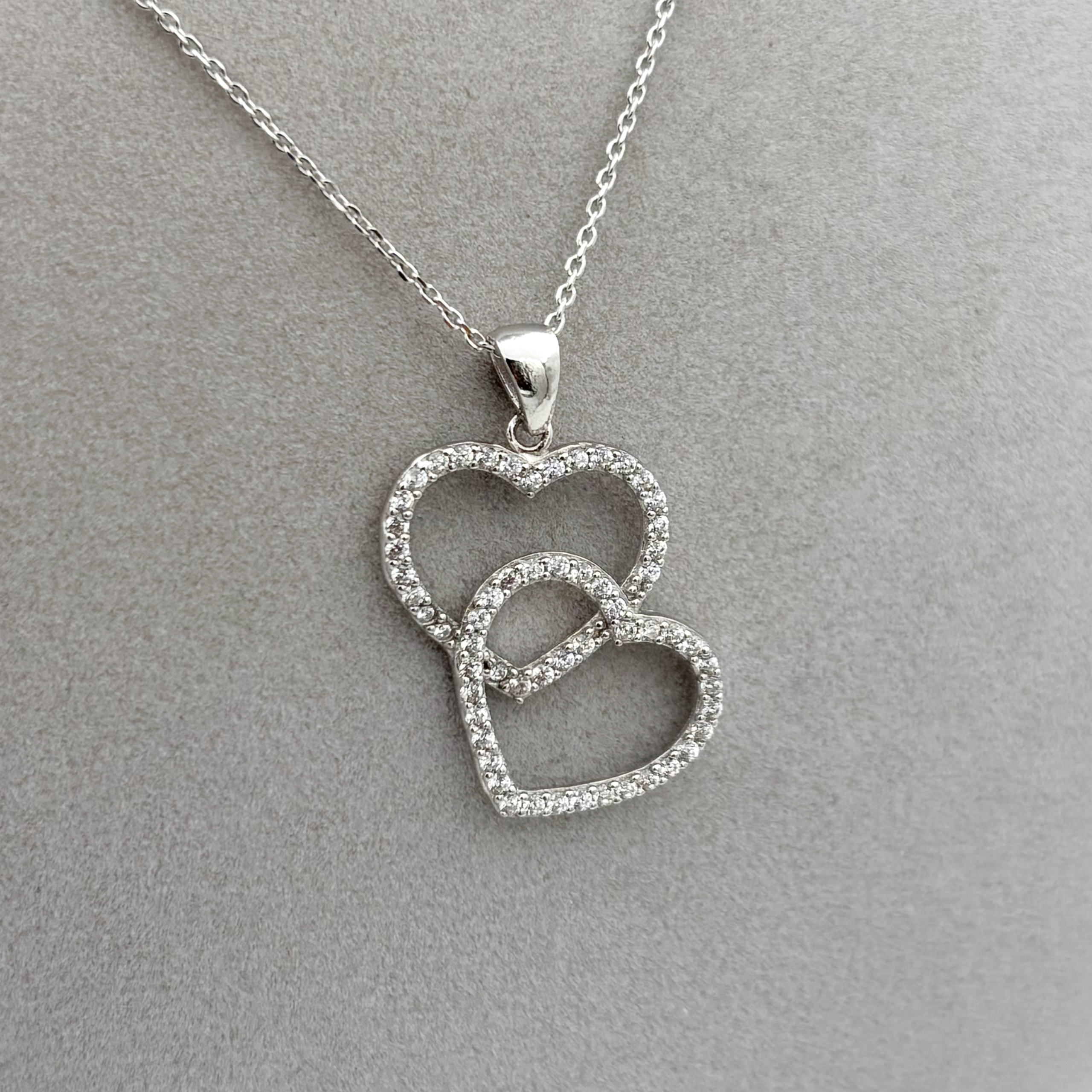 925-ayar-gumus-zirkon-tasli-cift-kalp-kolye-agkly18190725-02 Zirkon Taşlı Çift Kalp Kolye - Görsel 1